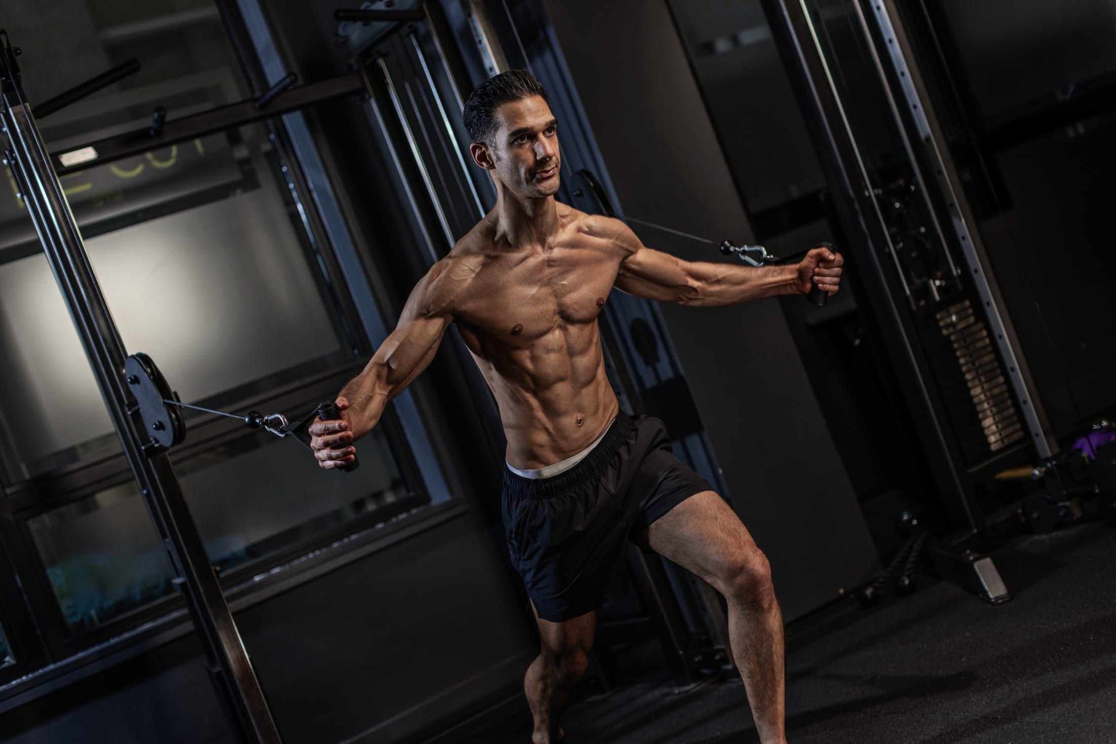 Gurinder Sandhu training on the cable machine during a physique session at UNTIL Soho