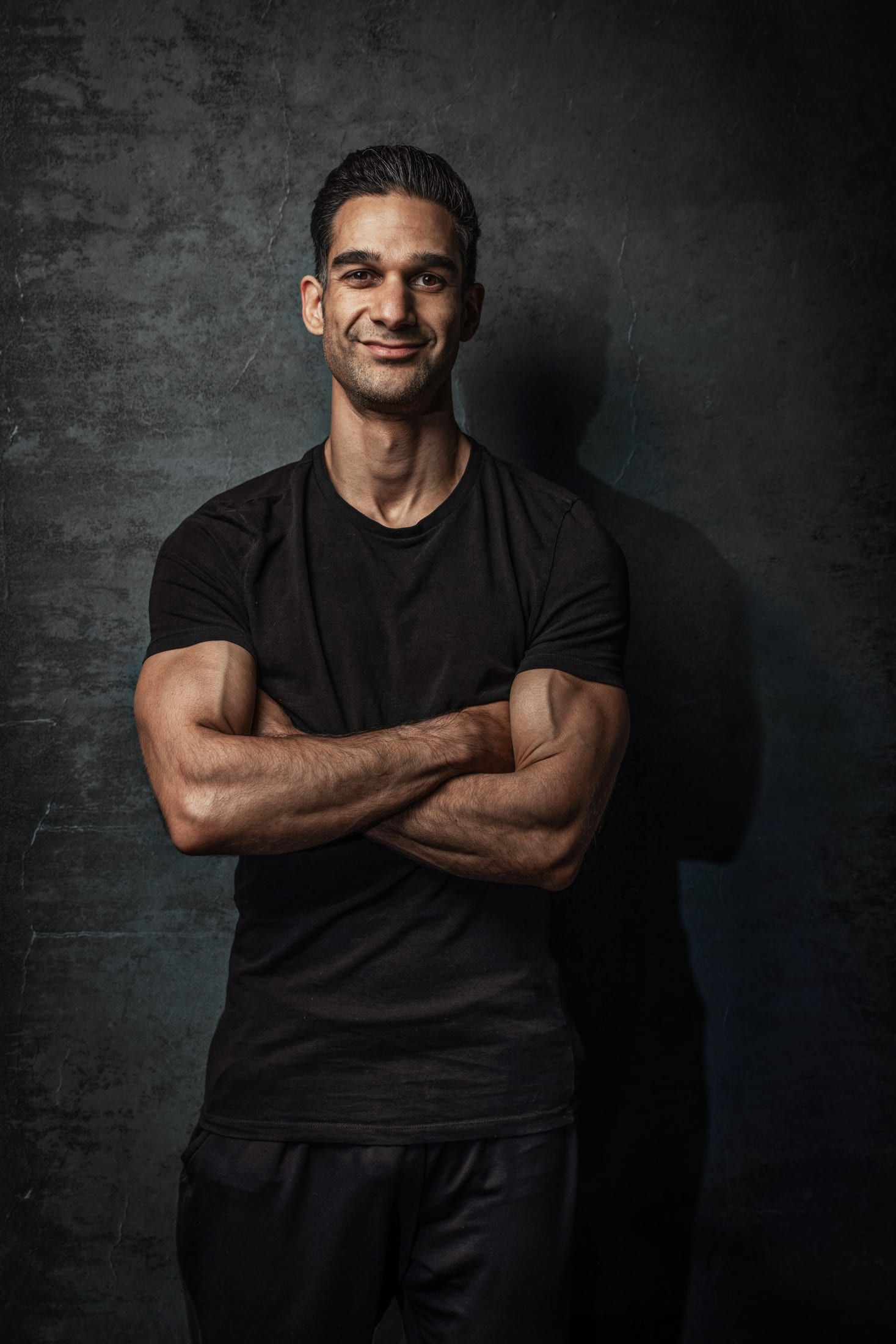 Gurinder Sandhu, personal trainer and back pain rehabilitation specialist, arms folded
